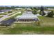 Gray house near water with a bridge and community visible at 108 Boundary Blvd # A&B, Rotonda West, FL 33947