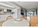 Open concept kitchen and dining area with white cabinets and a view to the water at 108 Boundary Blvd # A&B, Rotonda West, FL 33947