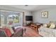 Living room with comfortable seating and canal views at 108 Boundary Blvd # A&B, Rotonda West, FL 33947