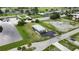 Single-story gray house with large yard and canal view at 108 Boundary Blvd # A&B, Rotonda West, FL 33947