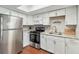 Modern kitchen with white cabinets and stainless steel appliances at 108 Boundary Blvd # A&B, Rotonda West, FL 33947