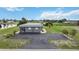 Gray house with spacious yard and water access at 108 Boundary Blvd # A&B, Rotonda West, FL 33947