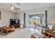 Living room with water views, comfortable seating and a large TV at 108 Boundary Blvd # A&B, Rotonda West, FL 33947