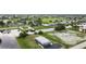 Aerial view showing home's location near canal and golf course at 108 Boundary Blvd # A&B, Rotonda West, FL 33947