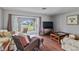 Living room with wicker furniture and water views at 108 Boundary Blvd # A&B, Rotonda West, FL 33947