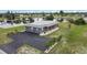 Gray house with water views and bridge in background at 108 Boundary Blvd # A&B, Rotonda West, FL 33947