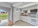 Kitchen with white cabinets and stainless steel appliances at 108 Boundary Blvd # A&B, Rotonda West, FL 33947