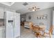 Eat-in kitchen with white cabinets and view to living room at 108 Boundary Blvd # A&B, Rotonda West, FL 33947