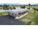 Single-story home with large driveway and waterfront view at 108 Boundary Blvd # A&B, Rotonda West, FL 33947