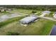 Gray house with a screened porch, and grassy yard at 108 Boundary Blvd # A&B, Rotonda West, FL 33947