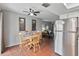 Dining area with wood table and chairs, adjacent to kitchen at 108 Boundary Blvd # A&B, Rotonda West, FL 33947