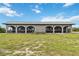 Rear view of house showing the long screened porch at 108 Boundary Blvd # A&B, Rotonda West, FL 33947