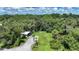 Aerial view of property with shed and pond at 5551 Reisterstown Rd, North Port, FL 34291