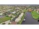 Aerial view of waterfront community with lush landscaping and private boat docks at 1400 Mineo Dr # 12-A, Punta Gorda, FL 33950