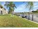 Backyard with grassy area and private boat dock access at 1400 Mineo Dr # 12-A, Punta Gorda, FL 33950