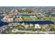 Aerial view of waterfront community, showcasing buildings, landscaping, and water access at 3251 White Ibis Ct # C4, Punta Gorda, FL 33950