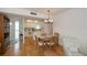 Charming dining area with wood floors and a view of the kitchen at 3251 White Ibis Ct # C4, Punta Gorda, FL 33950