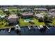 Aerial view showcasing community pool, canal, and boat docks at 3251 White Ibis Ct # C4, Punta Gorda, FL 33950