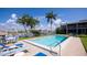 Inviting community pool with plenty of lounge chairs at 3251 White Ibis Ct # C4, Punta Gorda, FL 33950