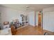 Bedroom with hardwood floors, built-in shelving, and access to a bathroom at 3251 White Ibis Ct # C4, Punta Gorda, FL 33950