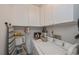 Laundry room with washer, dryer, and additional storage at 3251 White Ibis Ct # C4, Punta Gorda, FL 33950
