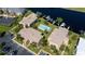 Aerial view of community with multiple buildings and a pool at 3251 White Ibis Ct # C4, Punta Gorda, FL 33950
