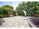 Large backyard patio with built-in grill and fire pit, perfect for outdoor entertaining at 28 Colony Point Dr, Punta Gorda, FL 33950