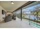 Spacious patio with canal views adjacent to the refreshing pool at 28 Colony Point Dr, Punta Gorda, FL 33950