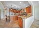 Large kitchen with granite island and custom cabinetry at 28 Colony Point Dr, Punta Gorda, FL 33950