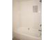 Clean bathroom with a new bathtub and tiled walls at 28 Colony Point Dr, Punta Gorda, FL 33950