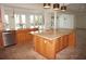 Kitchen features large island, granite, and stainless steel appliances at 28 Colony Point Dr, Punta Gorda, FL 33950