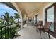 Serene balcony offering breathtaking waterfront views and comfortable seating at 28 Colony Point Dr, Punta Gorda, FL 33950