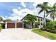Two-car garage with paver driveway at 28 Colony Point Dr, Punta Gorda, FL 33950