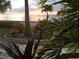 Stunning sunset view over the water from waterfront property at 28 Colony Point Dr, Punta Gorda, FL 33950