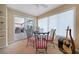 Cozy breakfast nook with glass table and pink chairs, access to patio at 28 Colony Point Dr, Punta Gorda, FL 33950