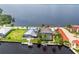 Aerial view of a waterfront property featuring a private pool and dock at 28 Colony Point Dr, Punta Gorda, FL 33950