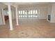 Spacious living area with pool view and tiled floors at 28 Colony Point Dr, Punta Gorda, FL 33950