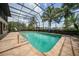 Inviting screened pool area with surrounding patio at 28 Colony Point Dr, Punta Gorda, FL 33950
