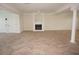 Large open basement space with tile flooring and a fireplace at 28 Colony Point Dr, Punta Gorda, FL 33950