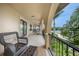 Relaxing waterfront balcony with wicker chairs and stunning water views at 28 Colony Point Dr, Punta Gorda, FL 33950