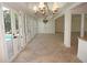 Elegant dining room with pool view and chandelier at 28 Colony Point Dr, Punta Gorda, FL 33950