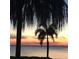 Scenic sunset view over calm waters from a waterfront home at 28 Colony Point Dr, Punta Gorda, FL 33950