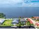 Aerial view of waterfront home with pool and private dock at 28 Colony Point Dr, Punta Gorda, FL 33950