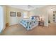 Cozy bedroom with a queen-size bed and ensuite bathroom access at 28 Colony Point Dr, Punta Gorda, FL 33950