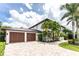 Two-car garage with paver driveway at 28 Colony Point Dr, Punta Gorda, FL 33950