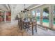 Dining room with pool access and wooden table at 28 Colony Point Dr, Punta Gorda, FL 33950