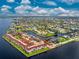 Wide aerial view of a waterfront home nestled in a community at 28 Colony Point Dr, Punta Gorda, FL 33950