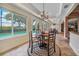Casual dining area with pool view and round table at 28 Colony Point Dr, Punta Gorda, FL 33950