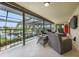 Covered balcony overlooking the canal, perfect for outdoor relaxation at 28 Colony Point Dr, Punta Gorda, FL 33950