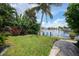 Beautiful canal-front property with lush landscaping and private dock at 28 Colony Point Dr, Punta Gorda, FL 33950